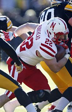 Rex Burkhead carries the football through traffic in the second half; Click for photo gallery