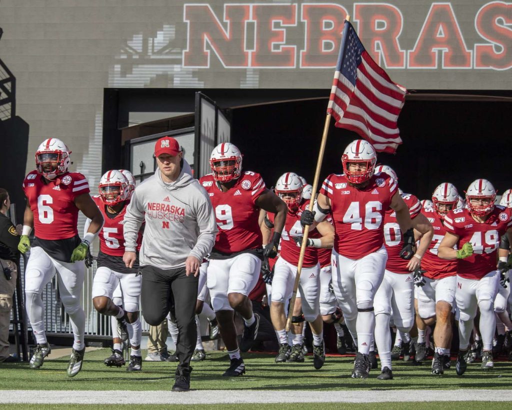 Scott Frost leads the Huskers onto the field